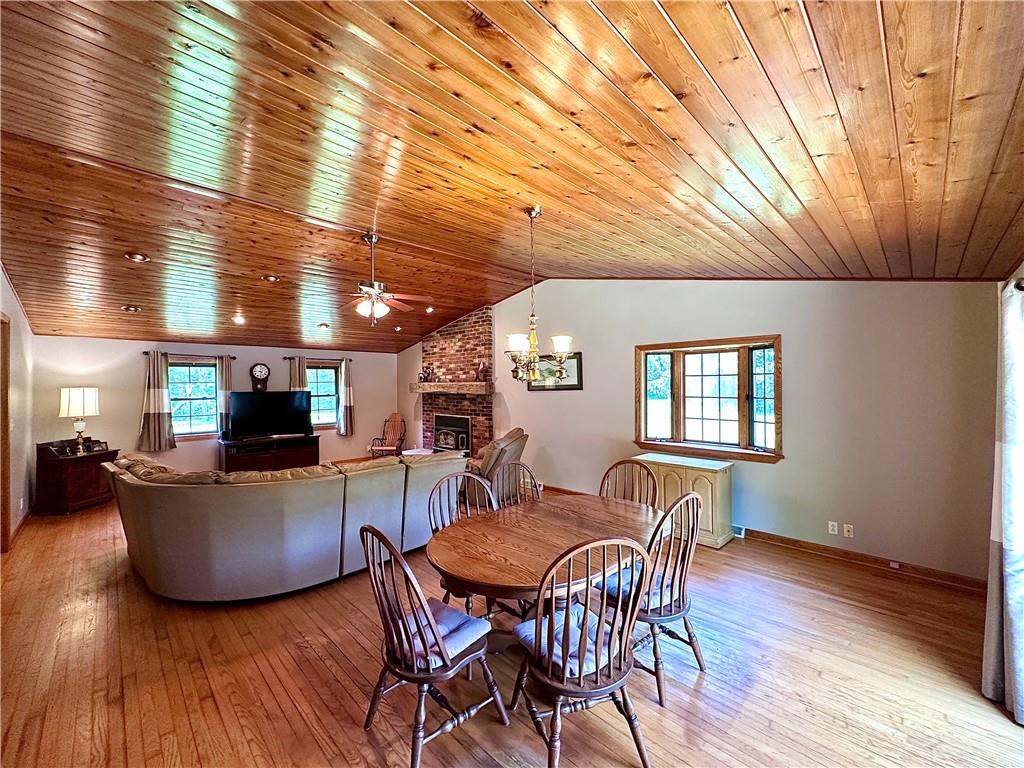 752 Covered Bridge Road Volant, PA 16156 - Photo 13 of 48 a view of a dining room with furniture and wooden floor