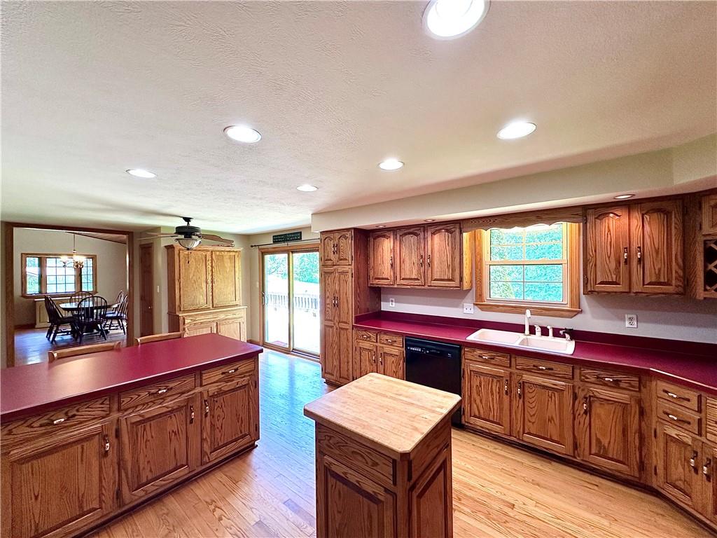752 Covered Bridge Road Volant, PA 16156 - Photo 18 of 48 a kitchen with a sink stove and cabinets