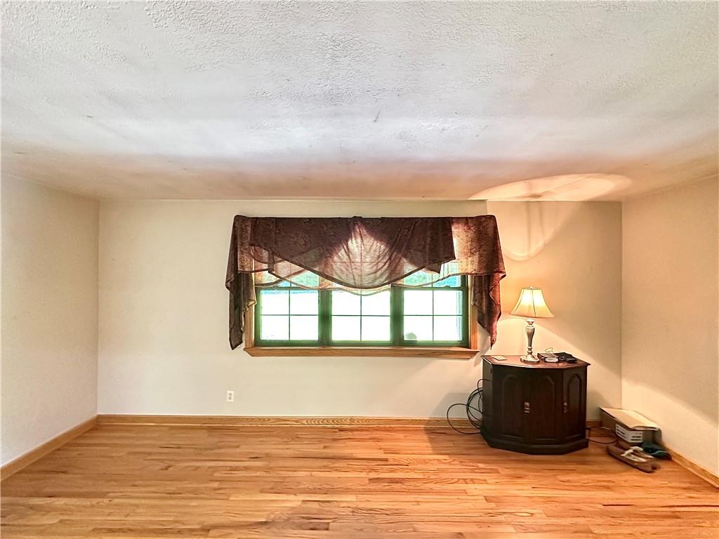 752 Covered Bridge Road Volant, PA 16156 - Photo 22 of 48 a view of a living room and a window
