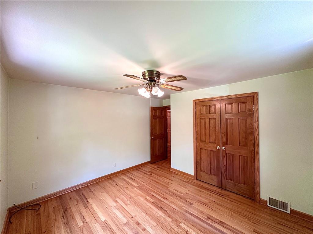 752 Covered Bridge Road Volant, PA 16156 - Photo 24 of 48 a view of empty room with wooden floor
