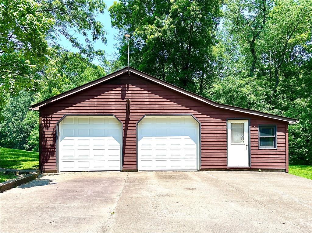 752 Covered Bridge Road Volant, PA 16156 - Photo 28 of 48 a front view of a house with a garage