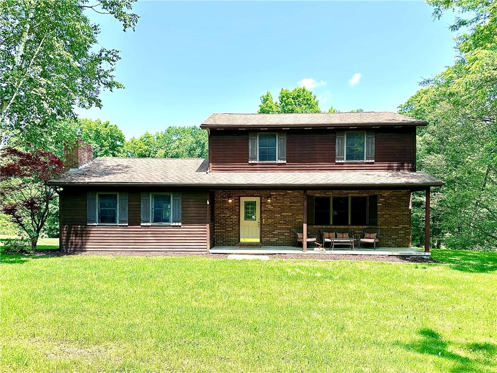 752 Covered Bridge Road Volant, PA 16156 - Photo 3 of 48 a view of a house with a yard patio and a garden