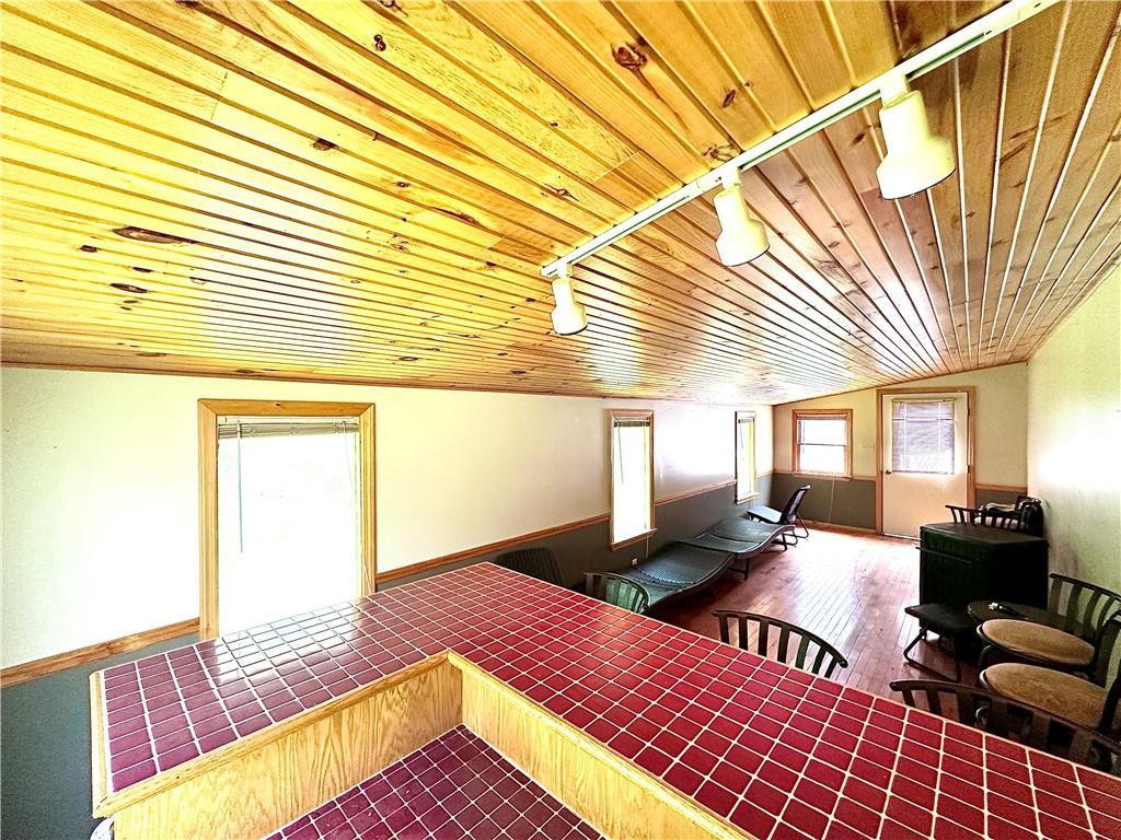 752 Covered Bridge Road Volant, PA 16156 - Photo 33 of 48 a living room with furniture and a wooden floor