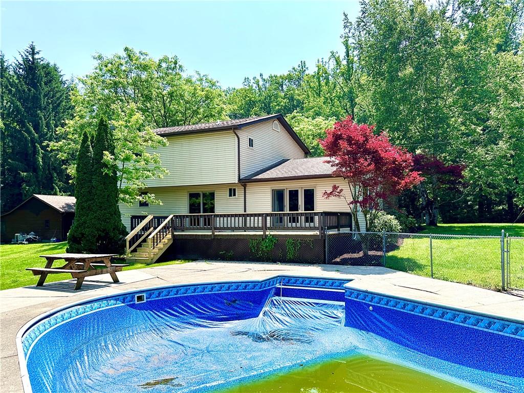 752 Covered Bridge Road Volant, PA 16156 - Photo 38 of 48 a view of house with swimming pool outdoor seating