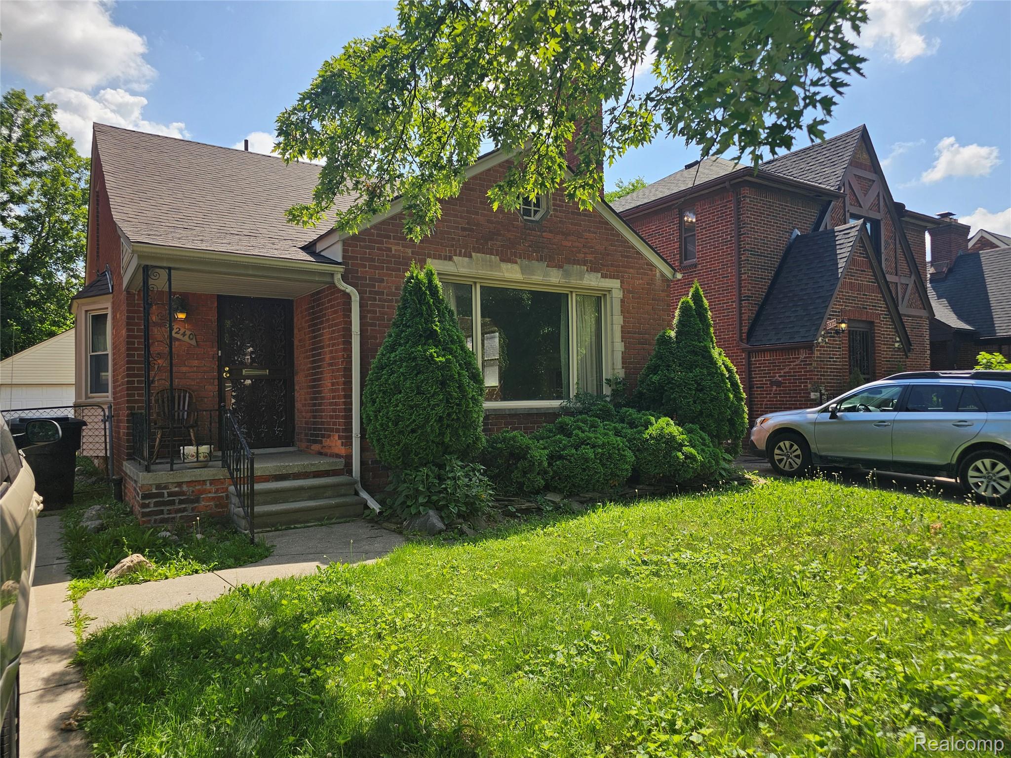5240 Harvard Road Detroit, MI 48224 - Photo 1 of 18 Brick-clad facade with a contrasting stone band and multiple window configurations