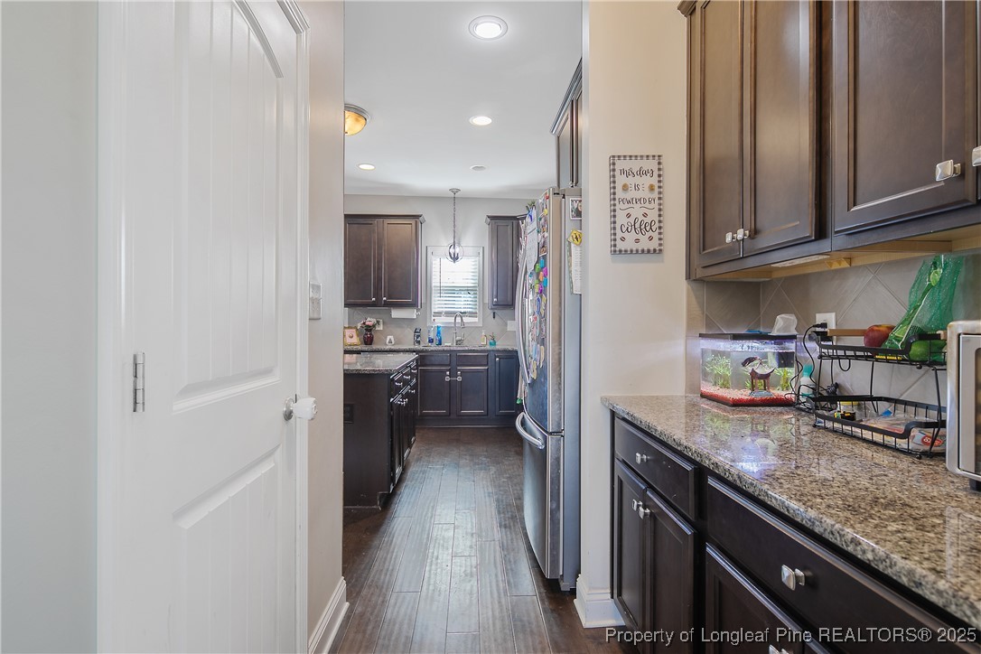 688 Stonebriar Avenue Raeford, NC 28376 - Photo 14 of 50 a kitchen with stainless steel appliances granite countertop a lot of counter top space and cabinets