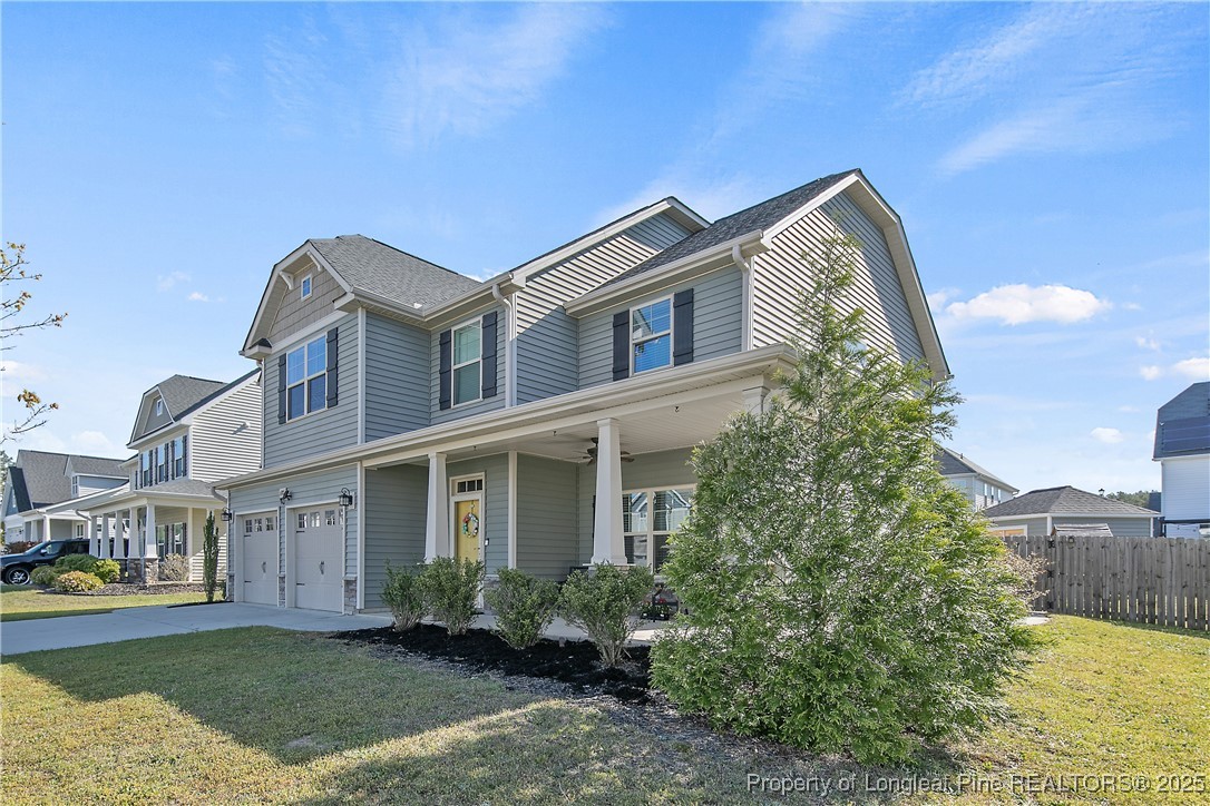 688 Stonebriar Avenue Raeford, NC 28376 - Photo 2 of 50 a front view of a house with garden
