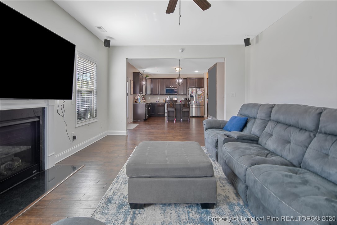 688 Stonebriar Avenue Raeford, NC 28376 - Photo 21 of 50 a living room with furniture and a flat screen tv
