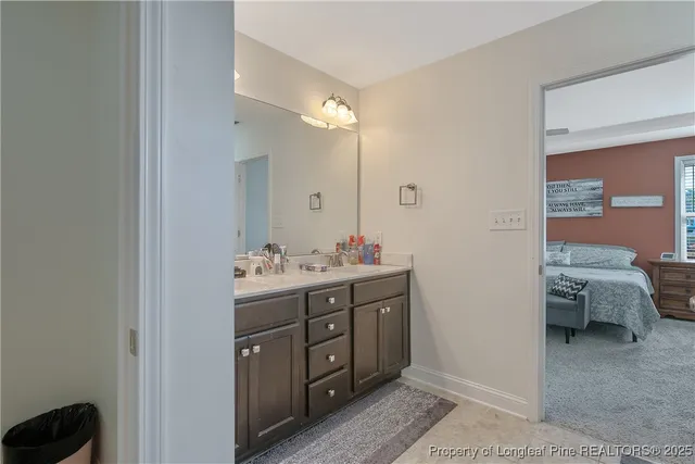 a bathroom with a double vanity sink and a mirror