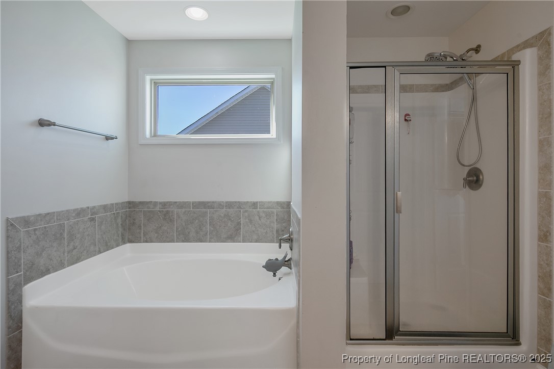 688 Stonebriar Avenue Raeford, NC 28376 - Photo 28 of 50 a bathroom with a bathtub
