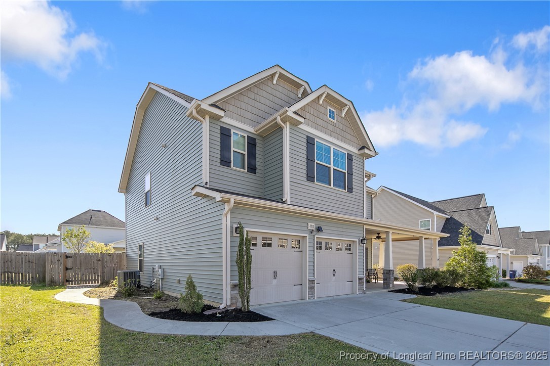 688 Stonebriar Avenue Raeford, NC 28376 - Photo 3 of 50 a front view of a house with a yard