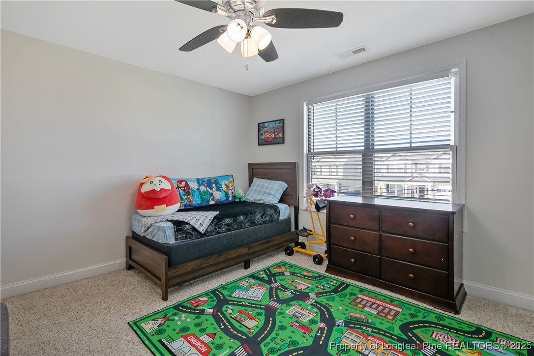 688 Stonebriar Avenue Raeford, NC 28376 - Photo 34 of 50 a bedroom with a bed and a dresser