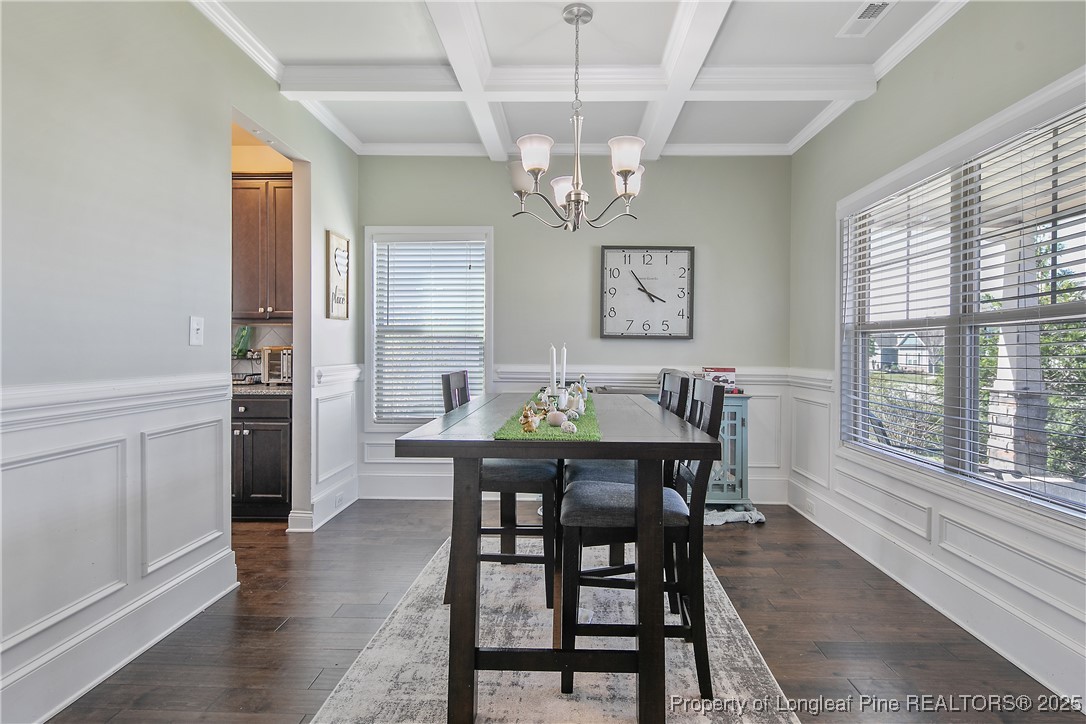 688 Stonebriar Avenue Raeford, NC 28376 - Photo 7 of 50 a view of a dining room with furniture window and wooden floor