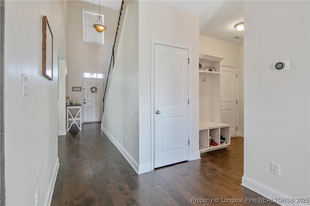 688 Stonebriar Avenue Raeford, NC 28376 - Photo 8 of 50 a view of a hallway view with wooden floor and staircase