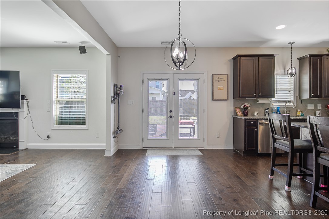 688 Stonebriar Avenue Raeford, NC 28376 - Photo 10 of 50 an empty room with wooden floor and windows