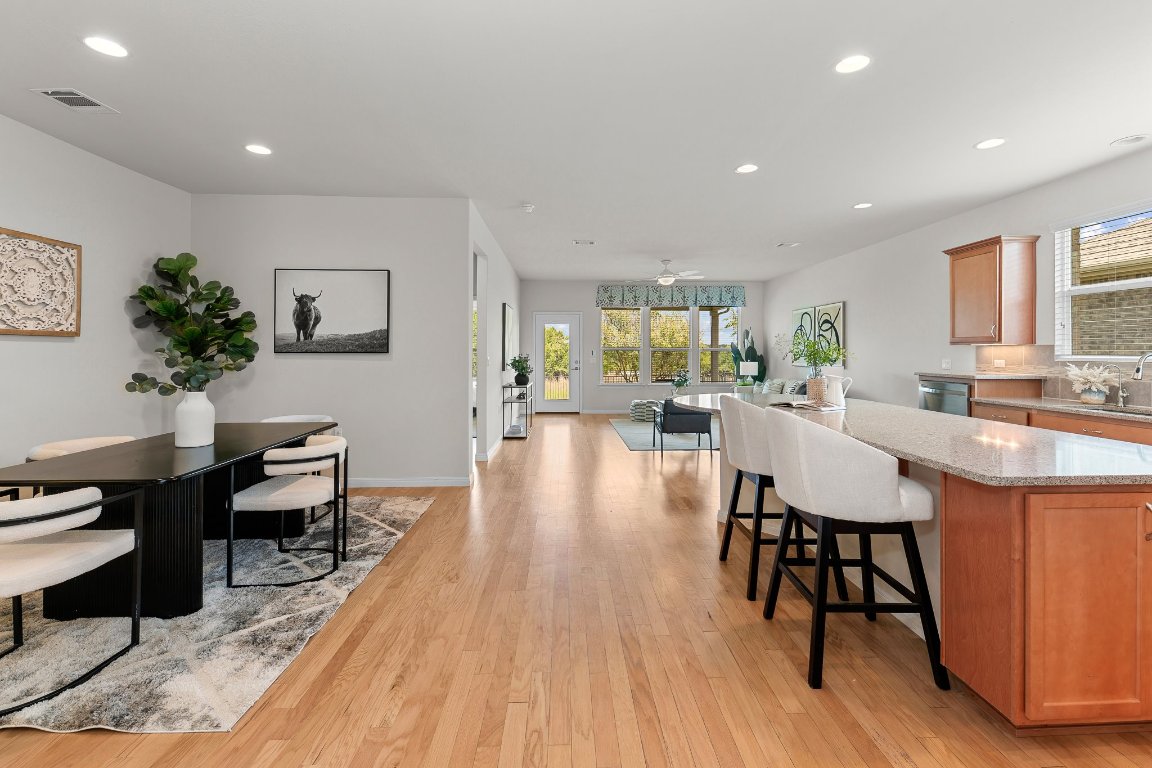608 Kite Ridge Street Georgetown, TX 78633 - Photo 11 of 39 a view of a dining room with furniture window and wooden floor