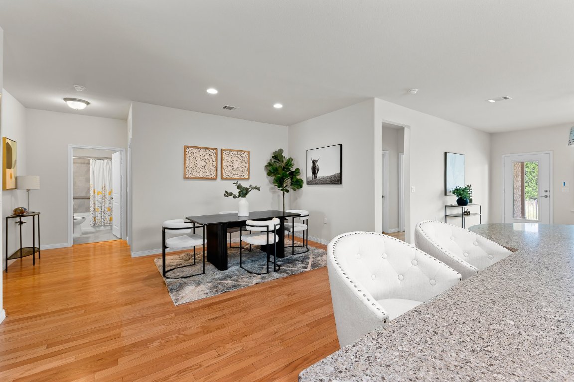 608 Kite Ridge Street Georgetown, TX 78633 - Photo 15 of 39 a living room with furniture a dining table and a potted plant