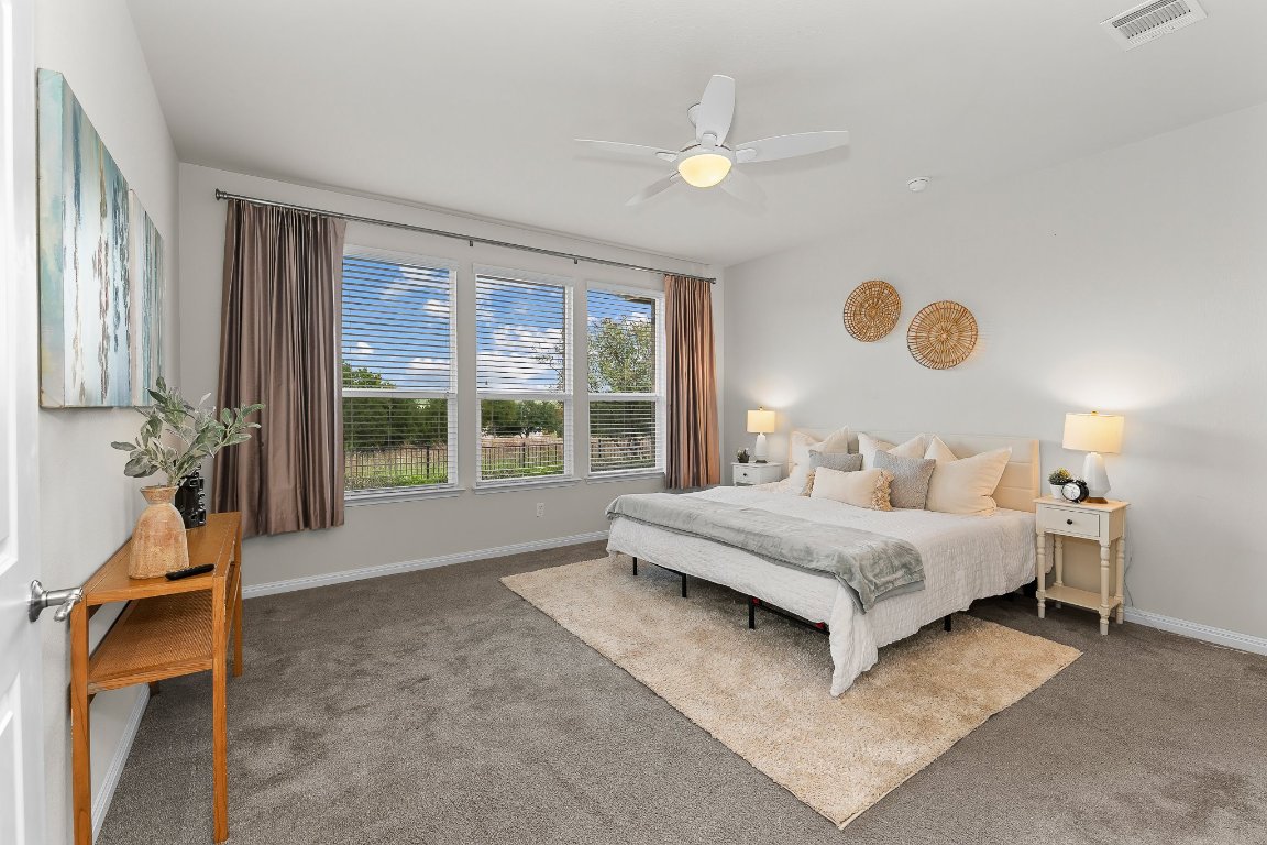 608 Kite Ridge Street Georgetown, TX 78633 - Photo 25 of 39 a spacious bedroom with a bed and window