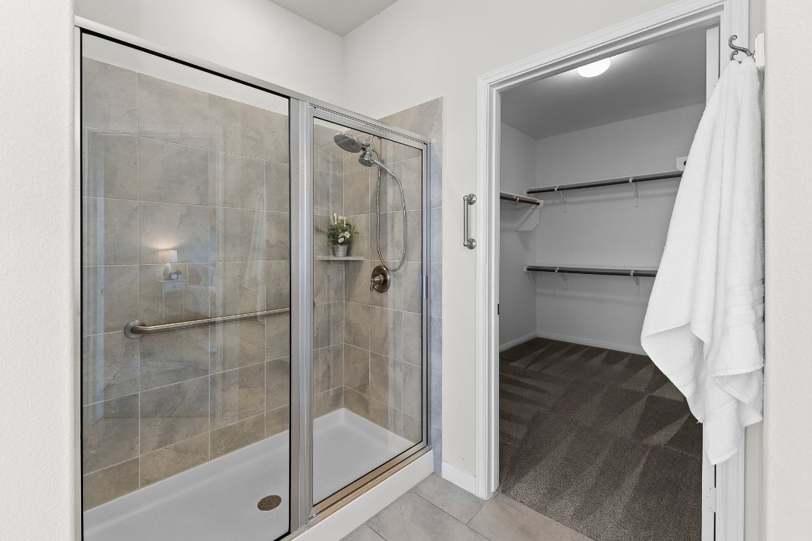 608 Kite Ridge Street Georgetown, TX 78633 - Photo 28 of 39 a bathroom with a shower and a glass door