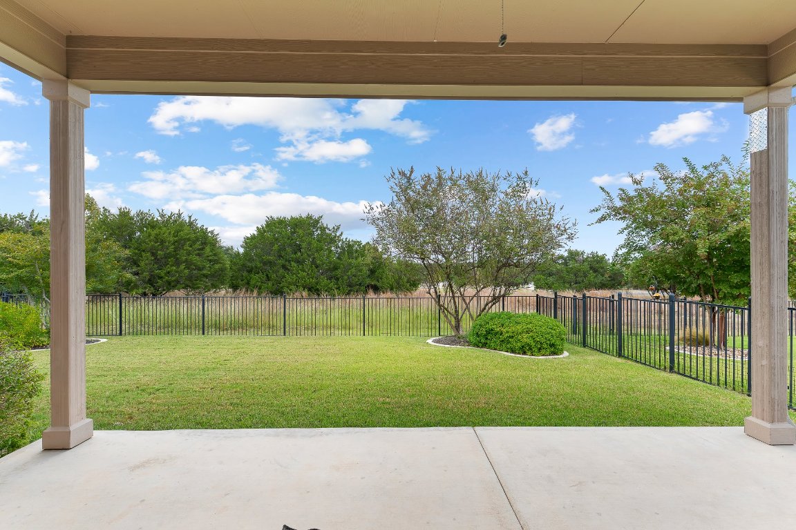 608 Kite Ridge Street Georgetown, TX 78633 - Photo 30 of 39 a view of a backyard with a garden