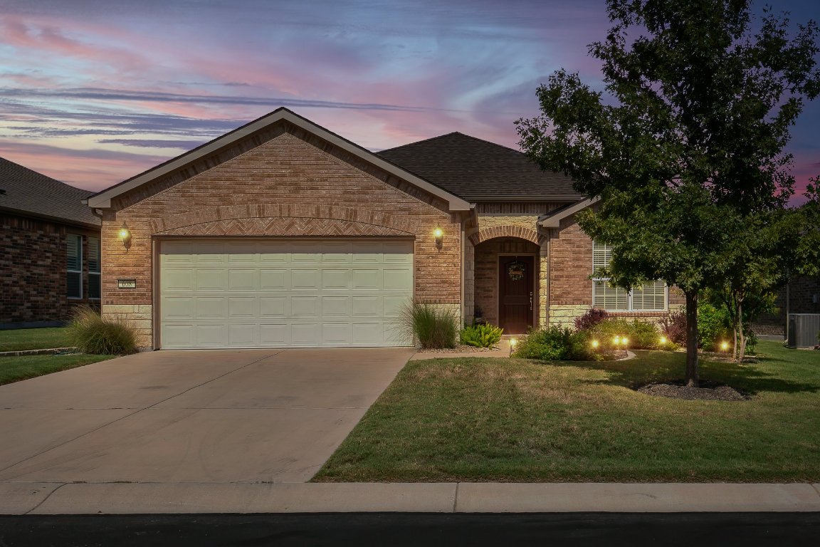 608 Kite Ridge Street Georgetown, TX 78633 - Photo 38 of 39 a front view of a house with garage and plants