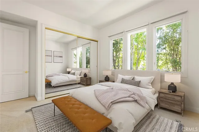 a bedroom with a bed and a couch