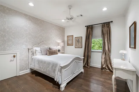a bedroom with a bed and a table