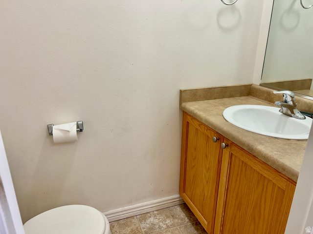334 West Rodeo Lane South Logan, UT 84321 - Photo 11 of 12 Bathroom vanity with a laminate countertop, integrated sink, and chrome faucet