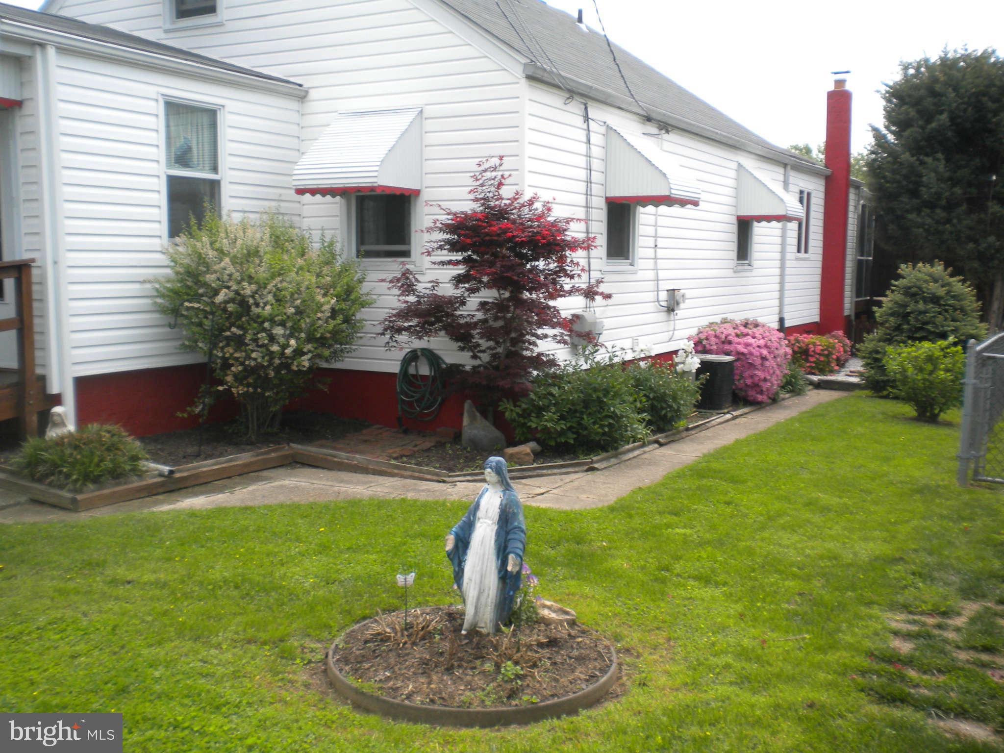 7614 Spruce Road Baltimore, MD 21222 - Photo 2 of 30 a house view with a garden space
