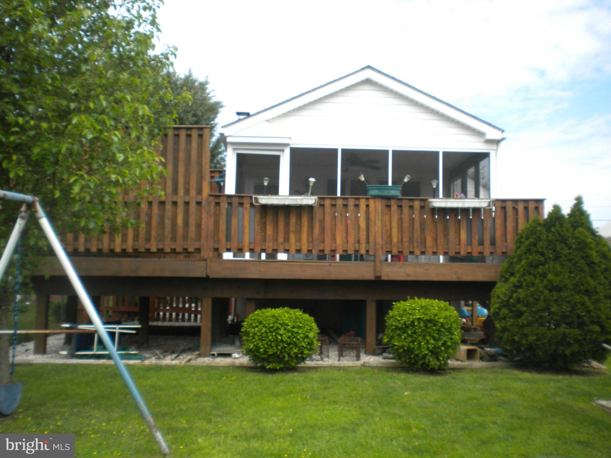 7614 Spruce Road Baltimore, MD 21222 - Photo 13 of 30 a front view of a house with garden