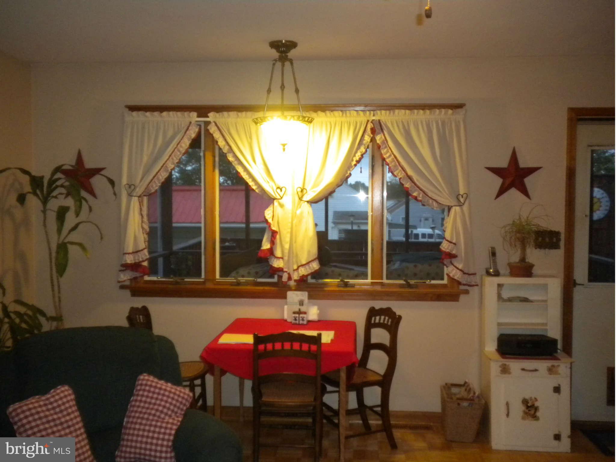7614 Spruce Road Baltimore, MD 21222 - Photo 15 of 30 a balcony with table and chairs