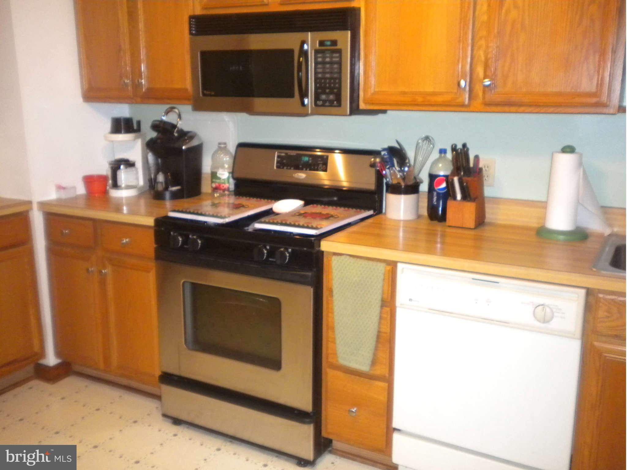 7614 Spruce Road Baltimore, MD 21222 - Photo 16 of 30 a kitchen with a stove and a sink