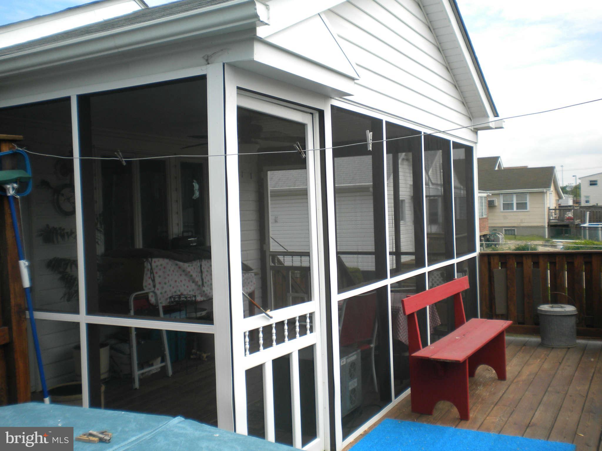 7614 Spruce Road Baltimore, MD 21222 - Photo 3 of 30 a view of a deck with wooden floor and outdoor seating