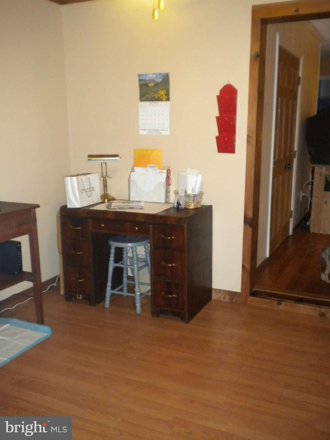 7614 Spruce Road Baltimore, MD 21222 - Photo 22 of 30 a room with a dresser and a mirror