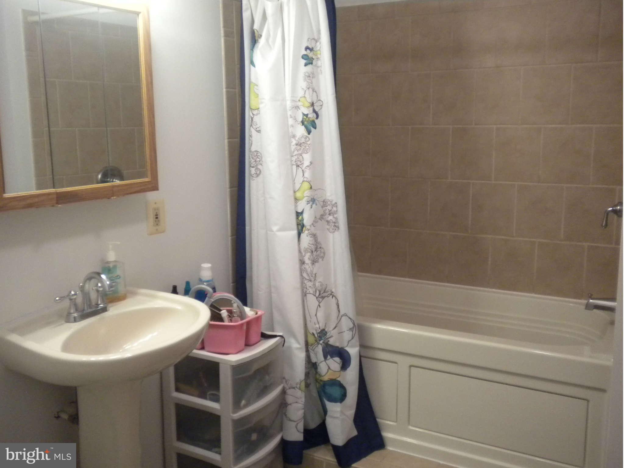 7614 Spruce Road Baltimore, MD 21222 - Photo 24 of 30 a bathroom with a sink and a mirror