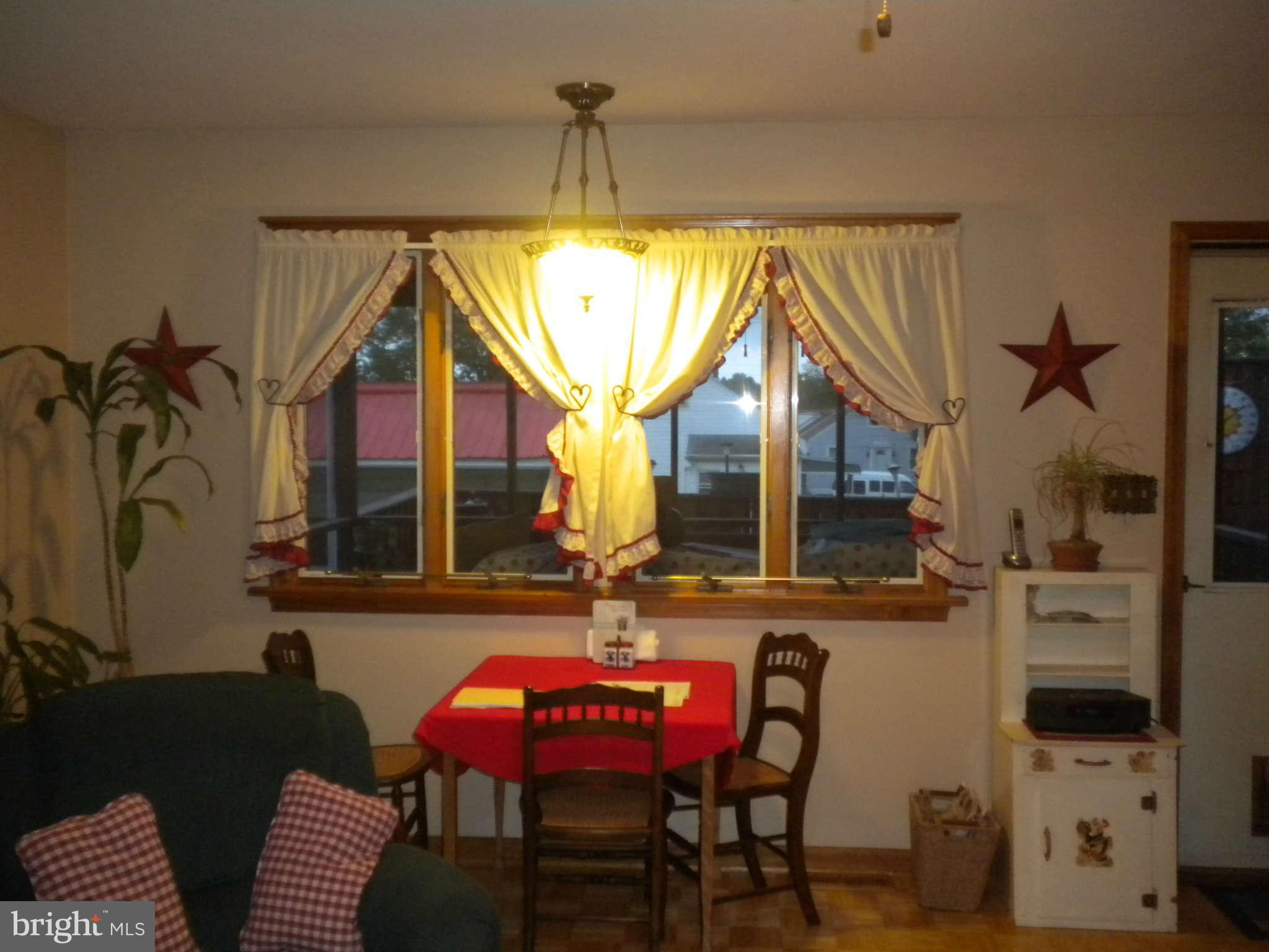 7614 Spruce Road Baltimore, MD 21222 - Photo 30 of 30 a balcony with table and chairs
