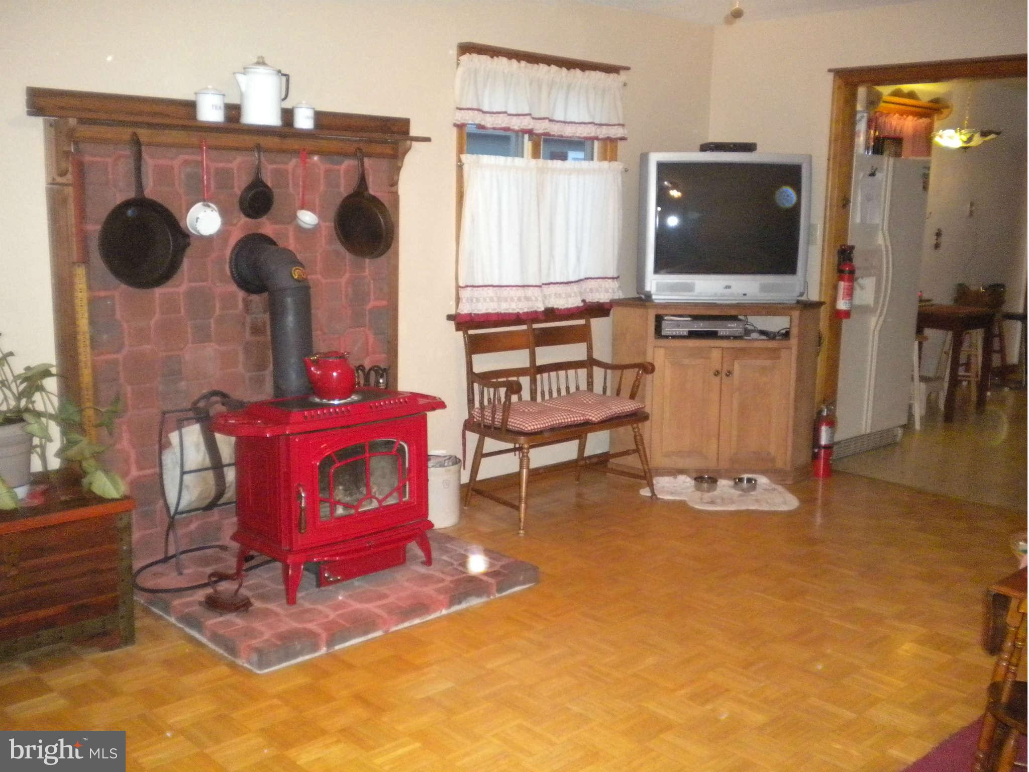 7614 Spruce Road Baltimore, MD 21222 - Photo 6 of 30 a living room with furniture and a flat screen tv