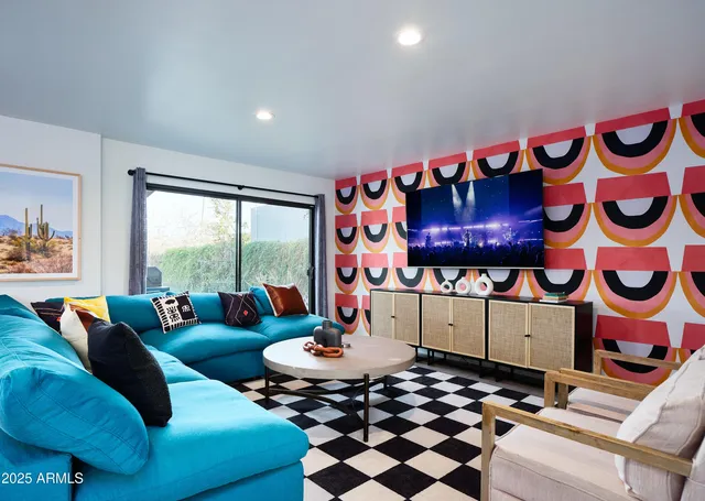 a living room with furniture and a rug