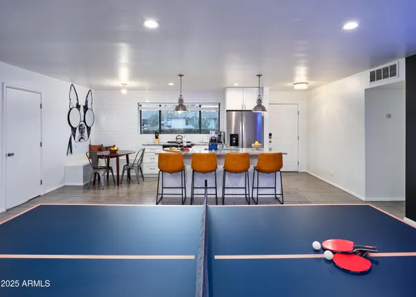 a dining room with furniture and a table