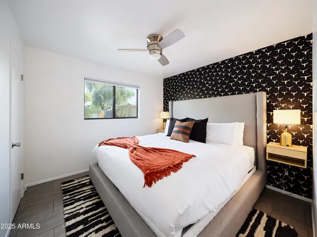 a bedroom with bed and window