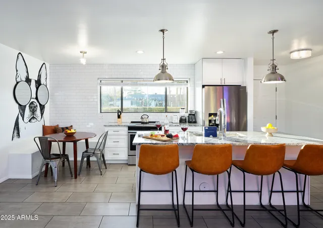a dining table and chairs in a kitchen