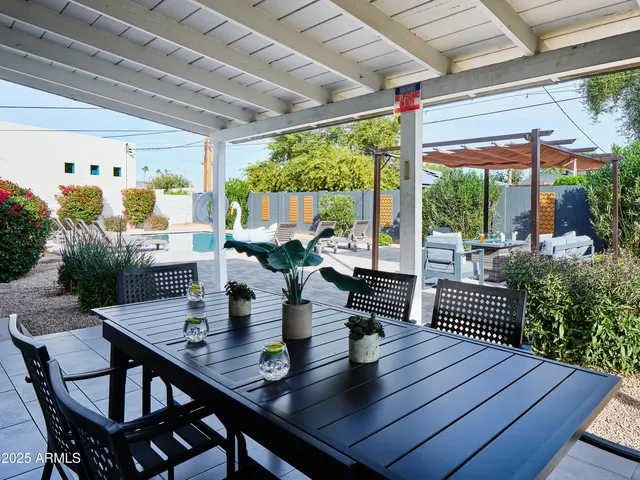 a view of a dining room with furniture window and outside view