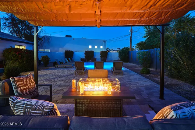 a view of a swimming pool with a patio