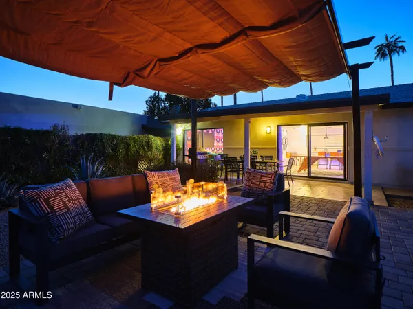a outdoor living space with furniture and a fireplace