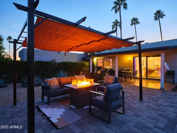a outdoor space with the couches and dining table with chairs