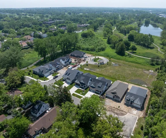 an aerial view of a house with yard