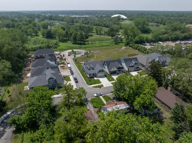 an aerial view of a house with outdoor space and street view
