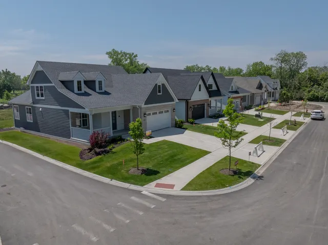 an aerial view of a house with a big yard