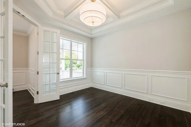 a kitchen with kitchen island a sink stainless steel appliances and cabinets