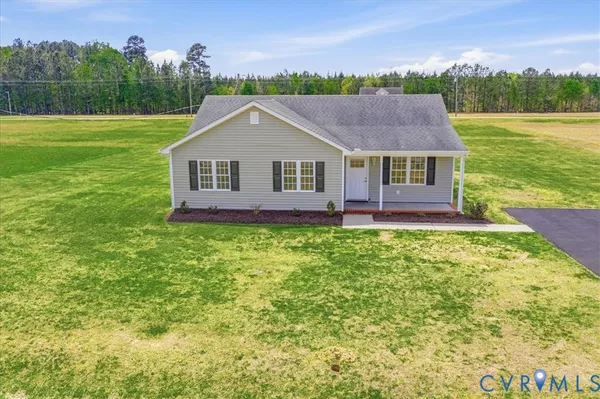 a view of a house with a big yard